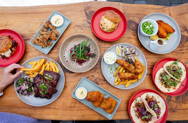 Flat lay of pub style food and drinks at The Grand Hotel