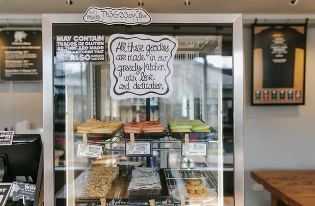 A cabinet of sweets inside a small glass cabinet at the Greedy Cow Café in Tekapo.