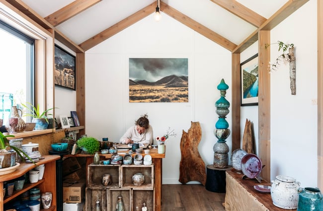 Gallery space with owner behind the counter at The Green.