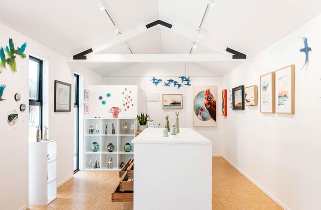 Gallery space with art displayed on the walls at The Green.