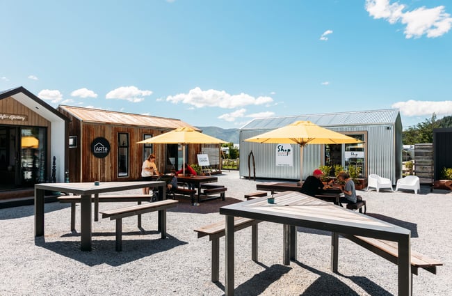 Outdoor common area with picnic tables at The Green.