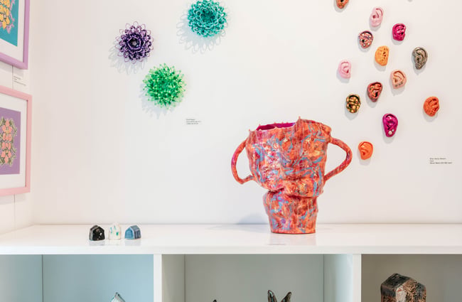 Pink vase displayed on a shelf at The Green.
