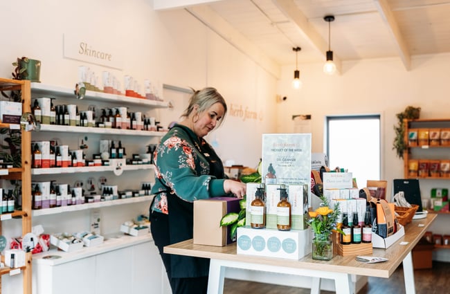 Customer browsing in the shop at The Herb Farm.