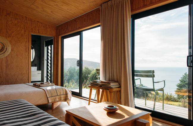 View from the bedroom to the ocean outside at The Huts.