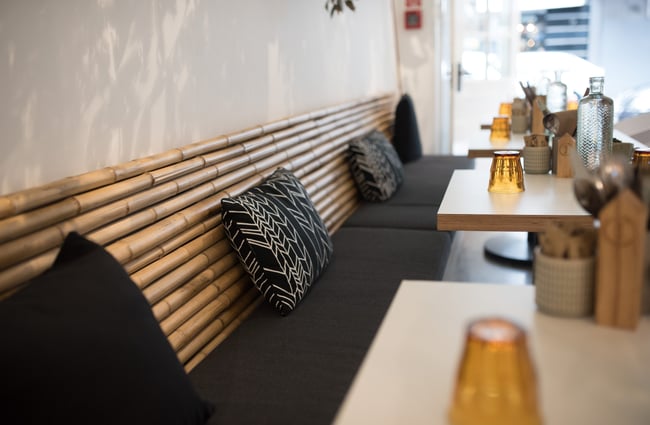 Black and wooden bench seating.