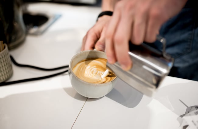 Pouring coffee.
