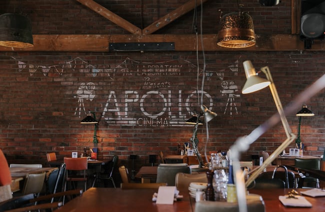 Seating area with exposed brick wall.