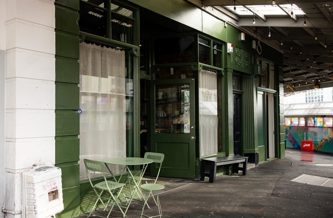 The green exterior of The Lebanese Grocer Auckland.