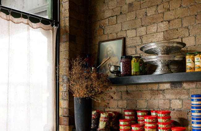 Condiments on display on shelves.