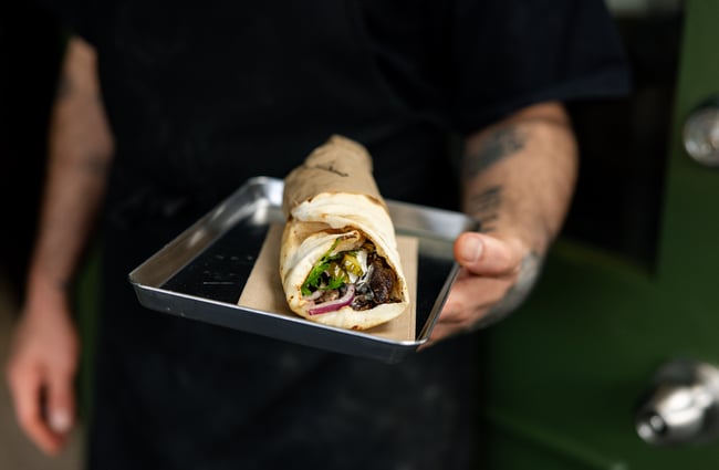 A close up of kebab on a tray.