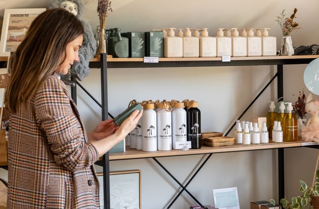 Customer looking at items for sale at The Lil Brew Espresso Bar.
