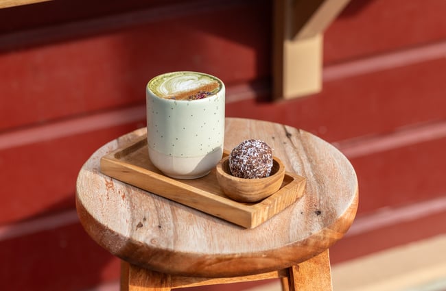 Coffee and food dish on the table at The Lil Brew Espresso Bar.