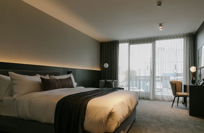 Inside a large bedroom at The Mayfair Christchurch.