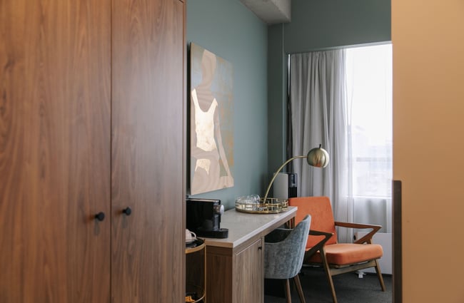A view of inside a hotel room photographed in a hallway.