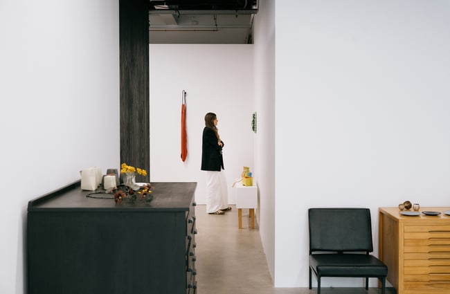 Woman admiring art on wall at The National gallery in Christchurch