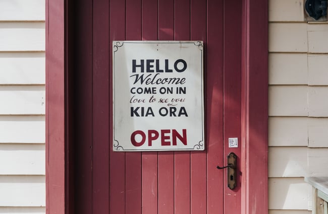 Welcome signage on the door into the building.