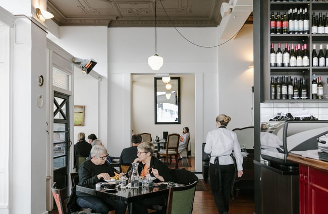 Customers sitting at tables inside The Oxford restaurant in Timaru.