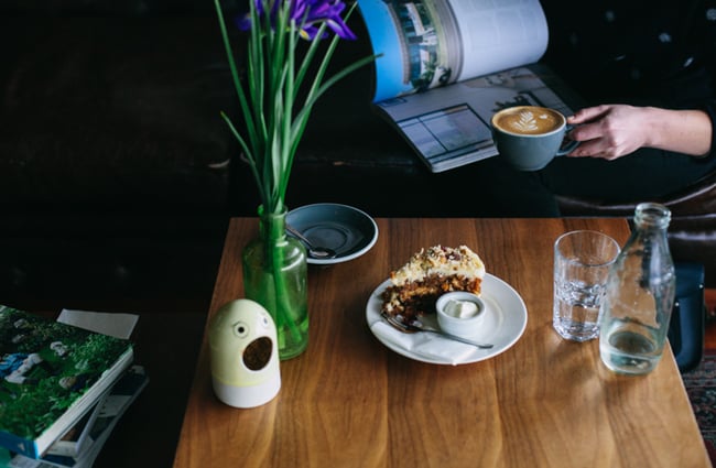 Cake and coffee on a table.