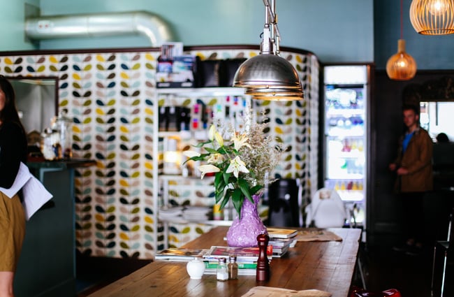 The large sharing table in the centre of the cafe.