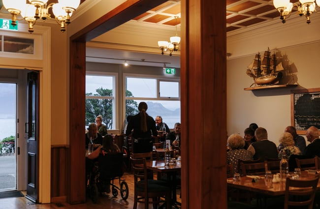 Lots of people dining in the hotel.
