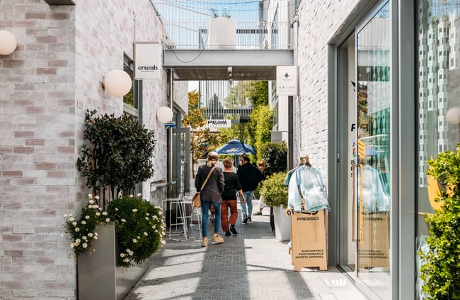 Customers walking down the alley of The Precinct.