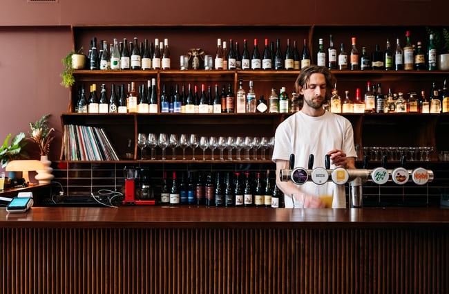 Bartender behind the bar at The Ram.