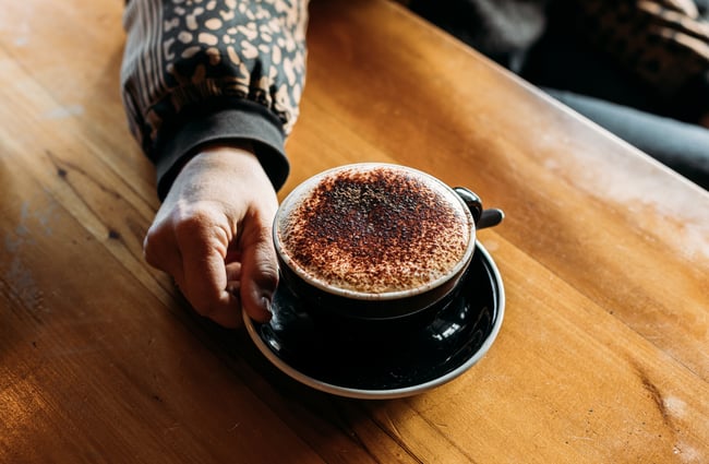 A close up of a hot chocolate on a table.