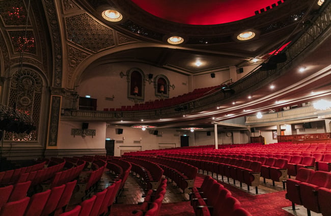 Red seating inside the theatre.