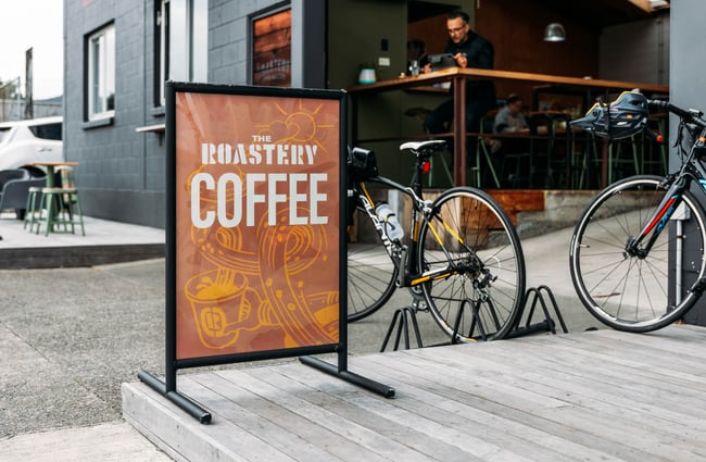 Signage outside the cafe and some bikes outside at The Roastery.