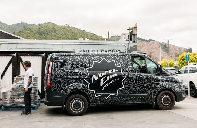 A van with 'North End' signage.