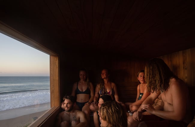People sitting in a sauna.