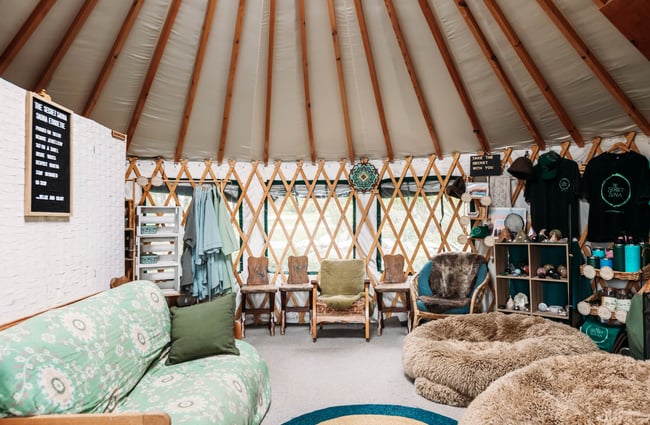 Sofa set up in the lounge yurt at Secret Sauna.