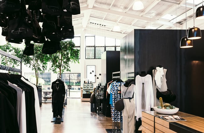 Interior of store with black and white clothing.