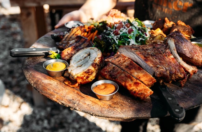 A close up of cooked meat on a platter.