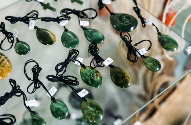 A close up of pounamu necklaces on display.