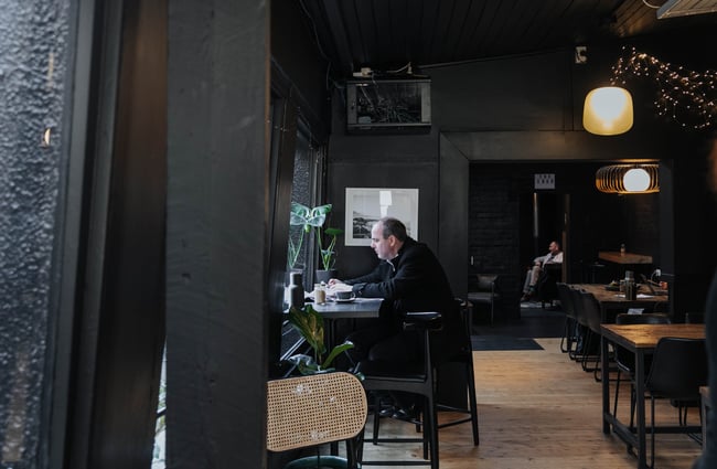 A man seated at a table.