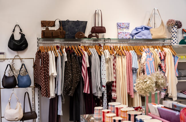 Racks of clothing in a shop at The Tannery.
