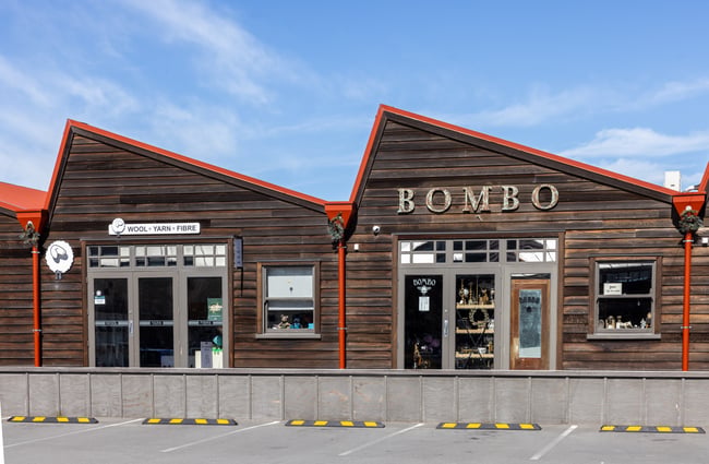 Wooden buildings on the boardwalk side of The Tannery.
