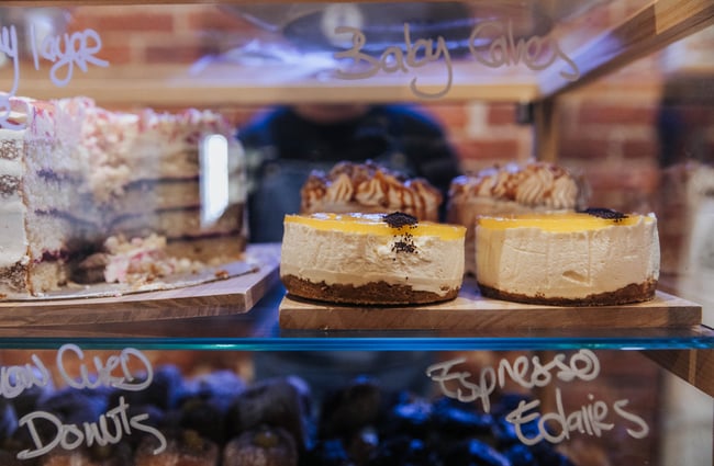 Close up of a cake in the glass cabinet.