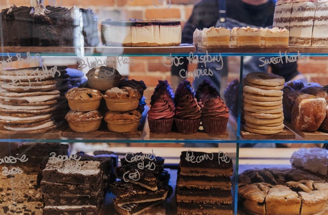 Close up of food in the glass cabinet.