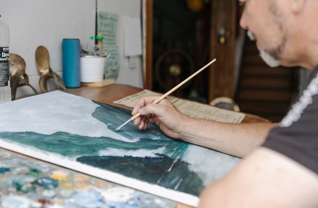 Close up of artist painting at The Terraces in Ōamaru.