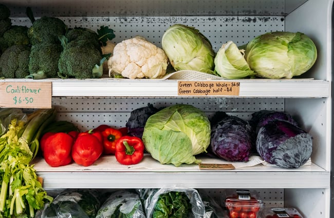 A close up of fresh vegetables on display.