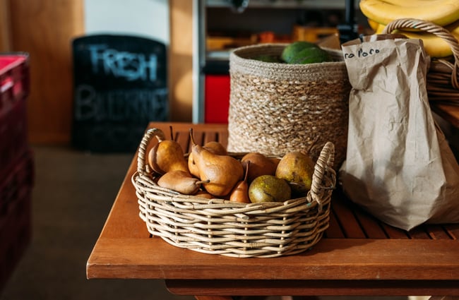 A close up of pears in a basket.