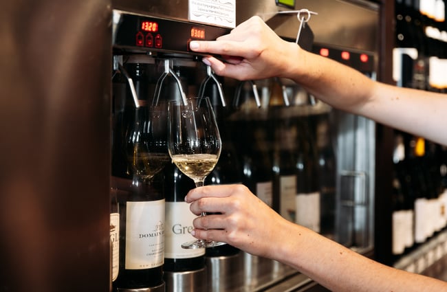 White wine being poured into a glass.