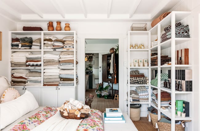 Bed display, with shelving unit at The Workroom.
