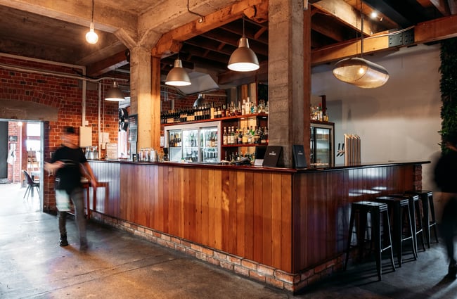The large wooden bar at The Works Gisborne.