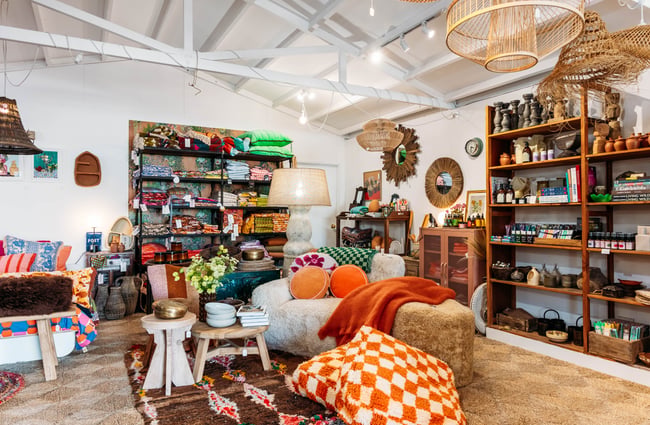Bright coloured homewares on display inside a large retail store.