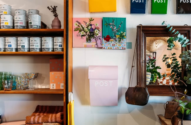 A close up of homewares for sale on a wall.