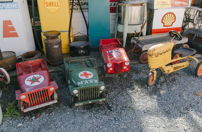 Mini retro kids cars lined up outside at Three Creeks.
