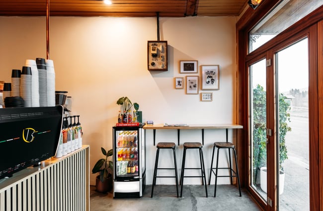 High bar seating inside a cafe.